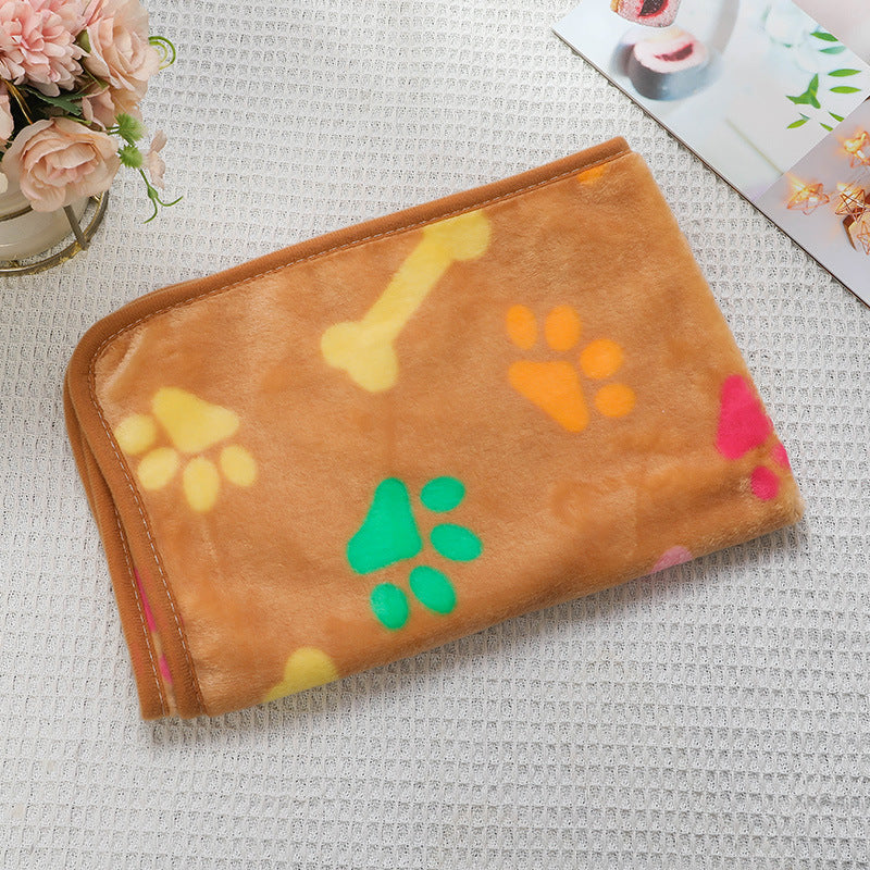 Brown pouch with colorful paw prints on a textured surface