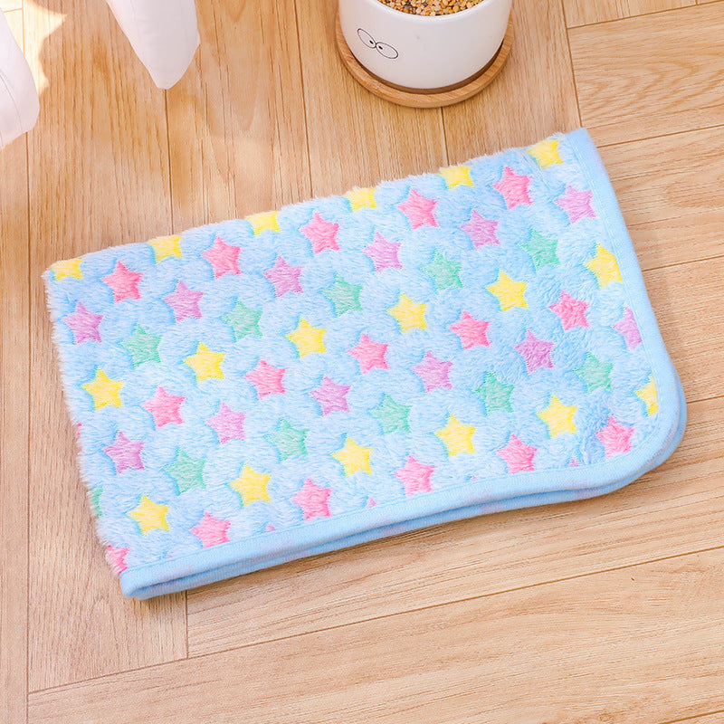 Colorful star-patterned towel on a wooden floor