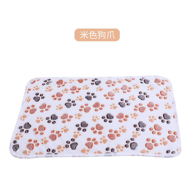 Dog paw print mat on a white background with text in an orange box.
