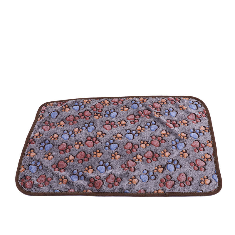 Pet mat with paw print pattern on a white background