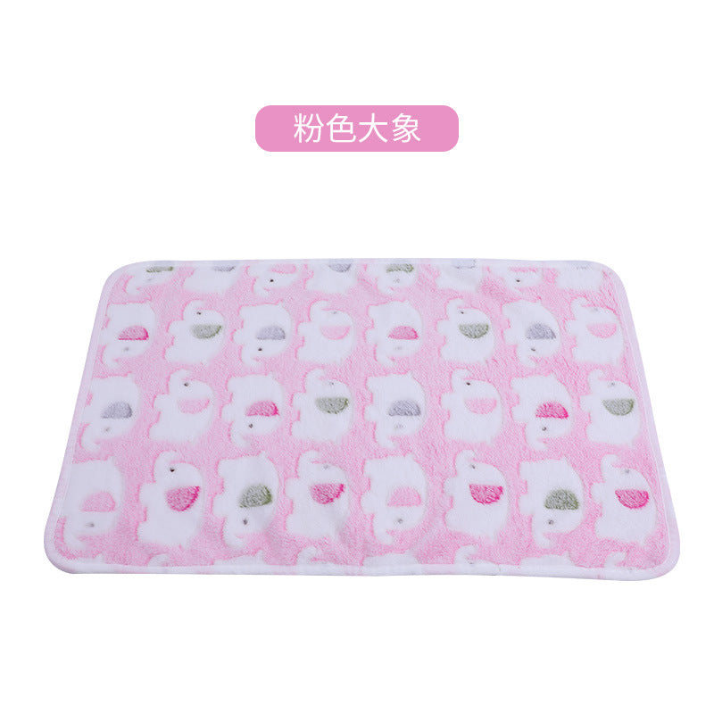 Pink bath mat with white elephant pattern on a white background
