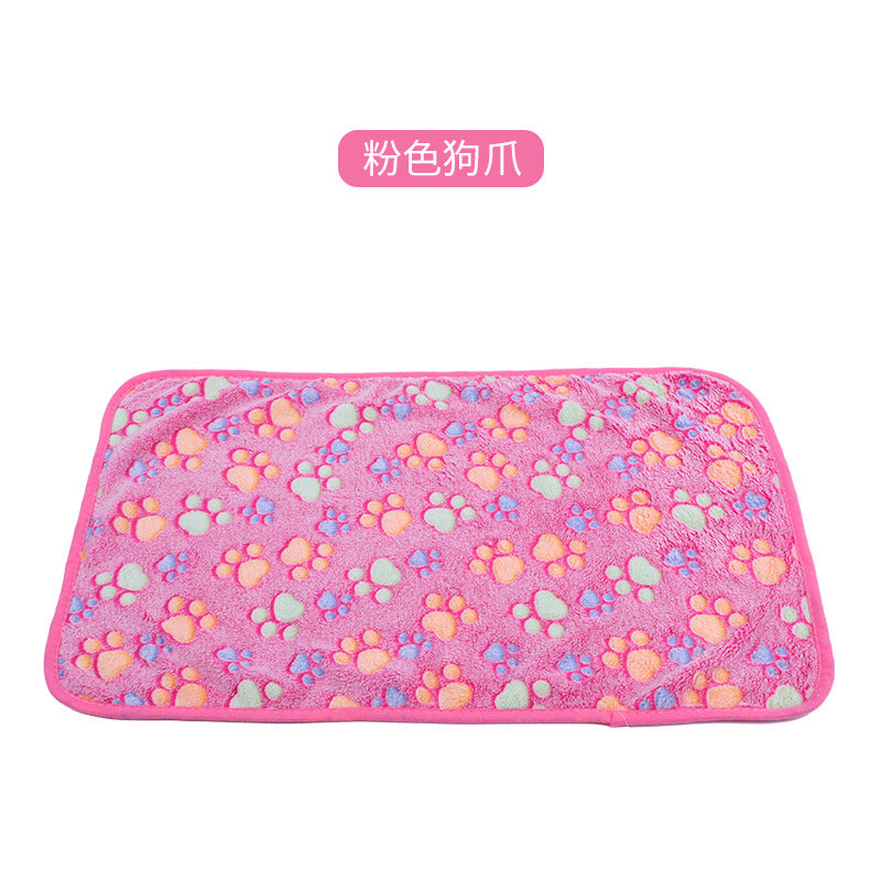 Pink mat with colorful paw prints on a white background