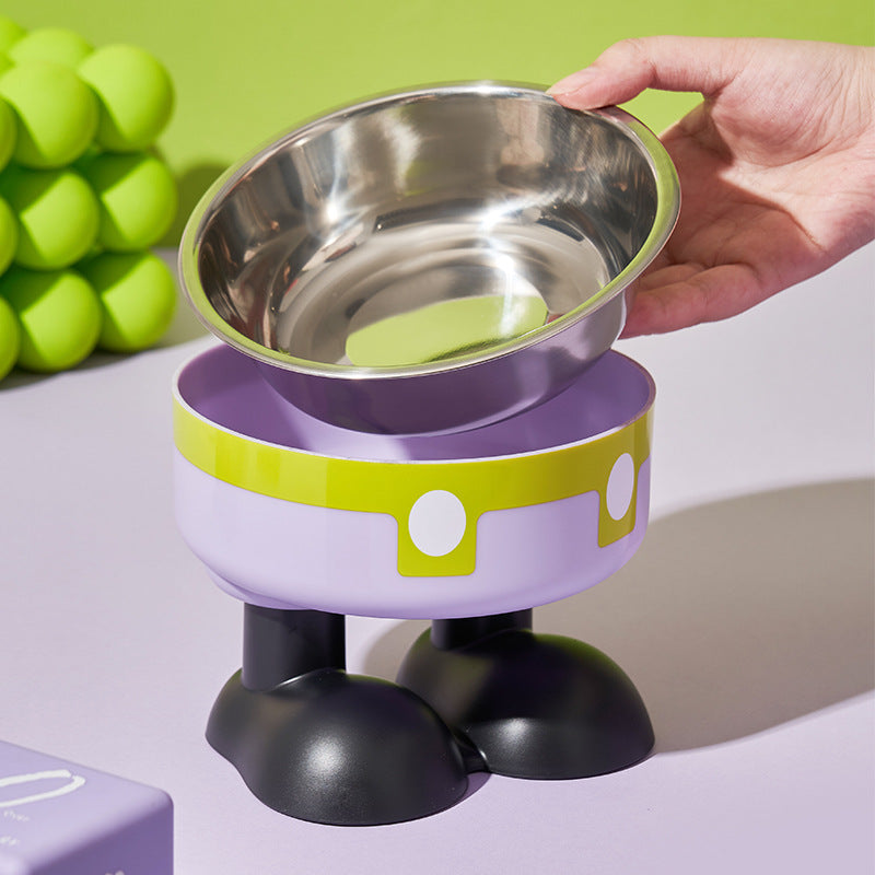 Purple and green elevated pet feeder with a hand lifting a metal bowl.