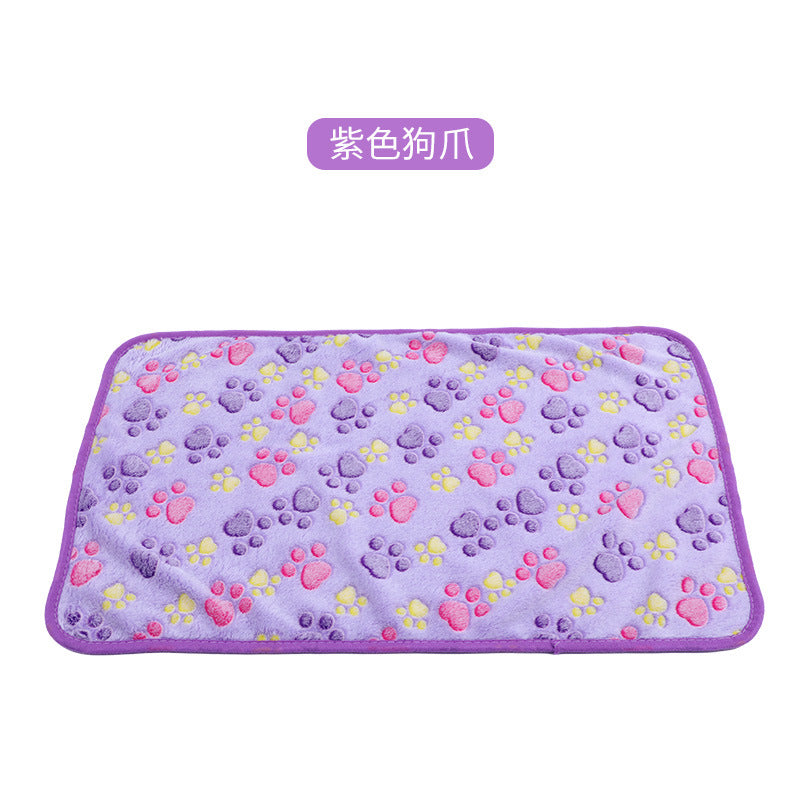 Purple pet mat with paw print pattern on a white background