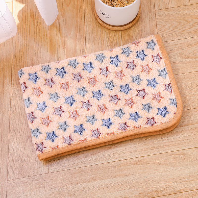 Star-patterned heating pad on a wooden floor