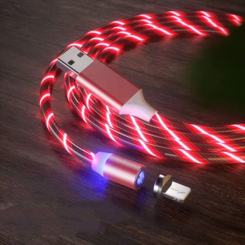 USB cable with LED lights on a wooden surface