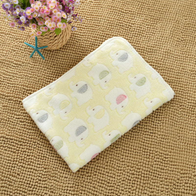 Yellow towel with duck pattern on a textured surface
