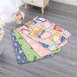 Set of cartoon-themed mats on a wooden floor with a small table and flowers in the background.