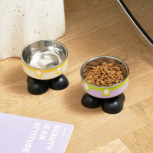 Two pet bowls on a wooden floor with one containing water and the other with kibble.