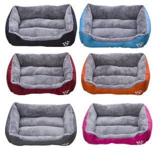 Set of six pet beds in different colors with paw prints on a white background